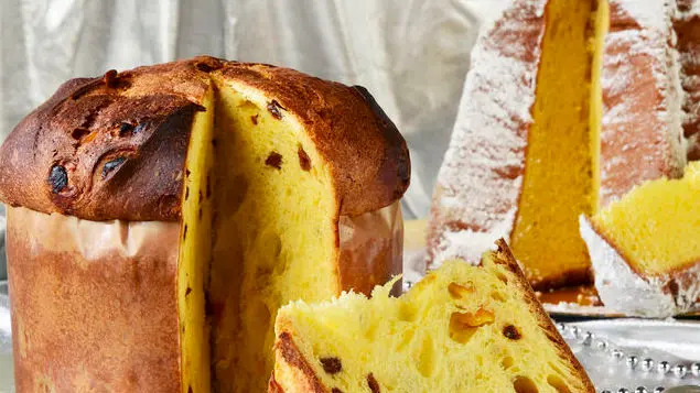 Christmas panettone and Pandoro on a silver plate with silver background