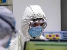 epa08227954 Employees work in the DaAn Gene laboratory in Guangzhou, Guangdong province, China, 19 February 2020. DaAn Gene Company of Sun Yat-Sun University focuses on the development and application of fluorescence PCR diagnostic kits. The company has developed the Covid-19 RNA detection kit. Many hospitals in Guangdong province are sending blood samples of patients for testing and the results must be finished within 24 hours. According to media reports, the Covid-19 coronavirus has left 2,000 people dead and infected 74,186 people in China. EPA/ALEX PLAVEVSKI