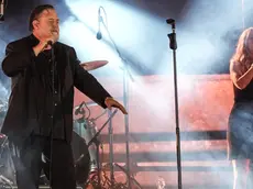 The new Zealander actor Russell Crowe on stage with his music band The Gentlemen Barbers in the Pompeii amphitheater in Naples, Italy, 09 July 2024.ANSA/CESARE ABBATE