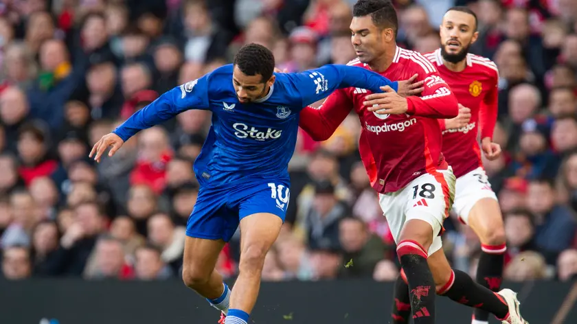 epa11751477 Iliman Ndiaye of Everton in action with Casemiro of Manchester United during the English Premier League match between Manchester United and Everton, in Manchester, Britain, 01 December 2024. EPA/PETER POWELL EDITORIAL USE ONLY. No use with unauthorized audio, video, data, fixture lists, club/league logos, 'live' services or NFTs. Online in-match use limited to 120 images, no video emulation. No use in betting, games or single club/league/player publications.