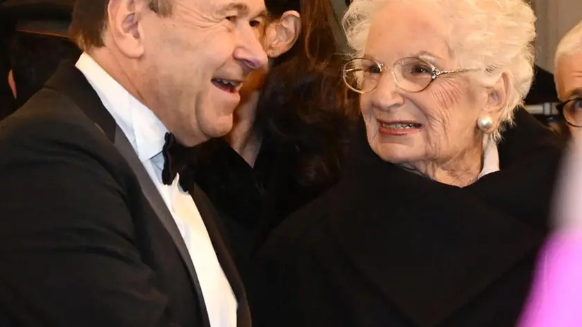 Italian senator for life Liliana Segre (R) is welcomed by the Teatro alla Scala superintendent Dominique Meyer at her arrival to attend the La Scala opera house's season opener Giuseppe Verdi's Don Carlo, in Milan, Italy, 7 December 2023. The Scala opera house season opener is considered one of the highlights of the European cultural calendar.ANSA/DANIEL DAL ZENNARO