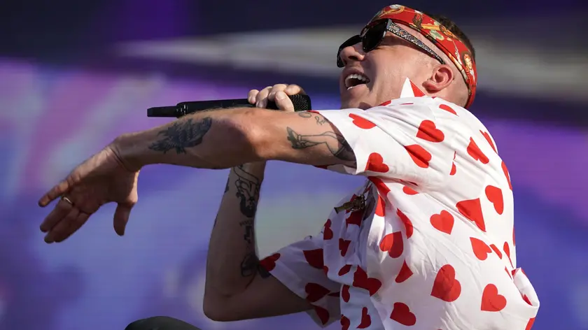 epa07669040 US rapper Ben Haggerty aka Macklemore performs on stage at the Southside festival in Neuhausen ob Eck, Germany, 23 June 2019. The festival takes place from 21 to 23 June. EPA/RONALD WITTEK